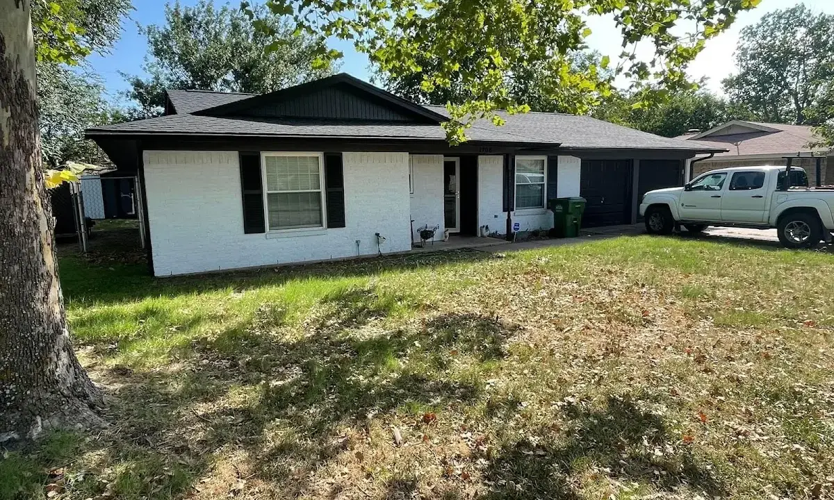 Professional roofing crew working on a residential roof in Skippack